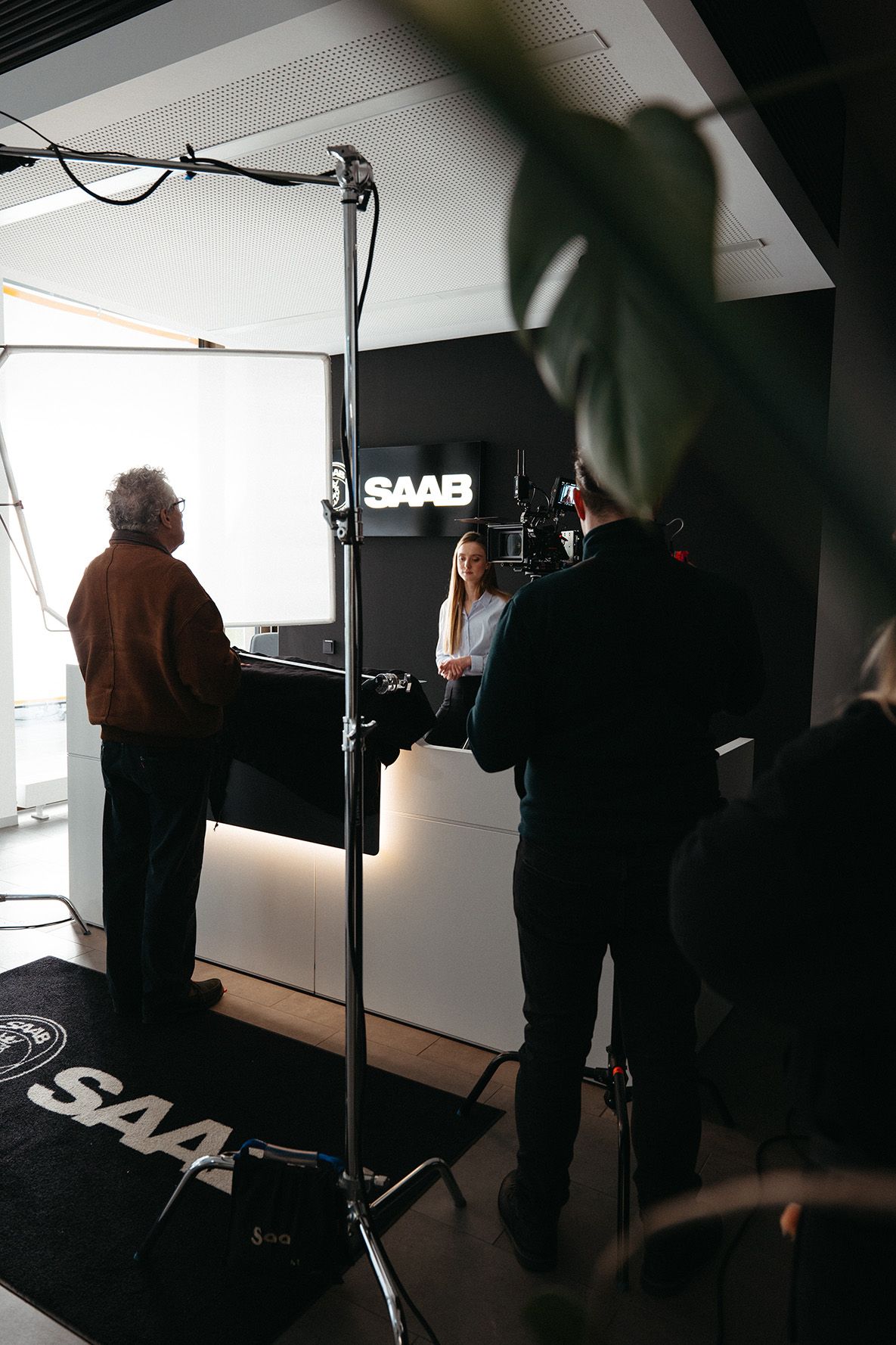 The 'Visionary & The Gang' production crew sets up a shot outside the Saab Technologies building, capturing a key scene for the brand film.