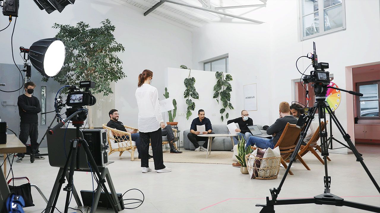 A wide view of the Visionary Berlin studio during the Huawei Rebels production, showing the full multi-camera setup, crew, and talent for the talk show.