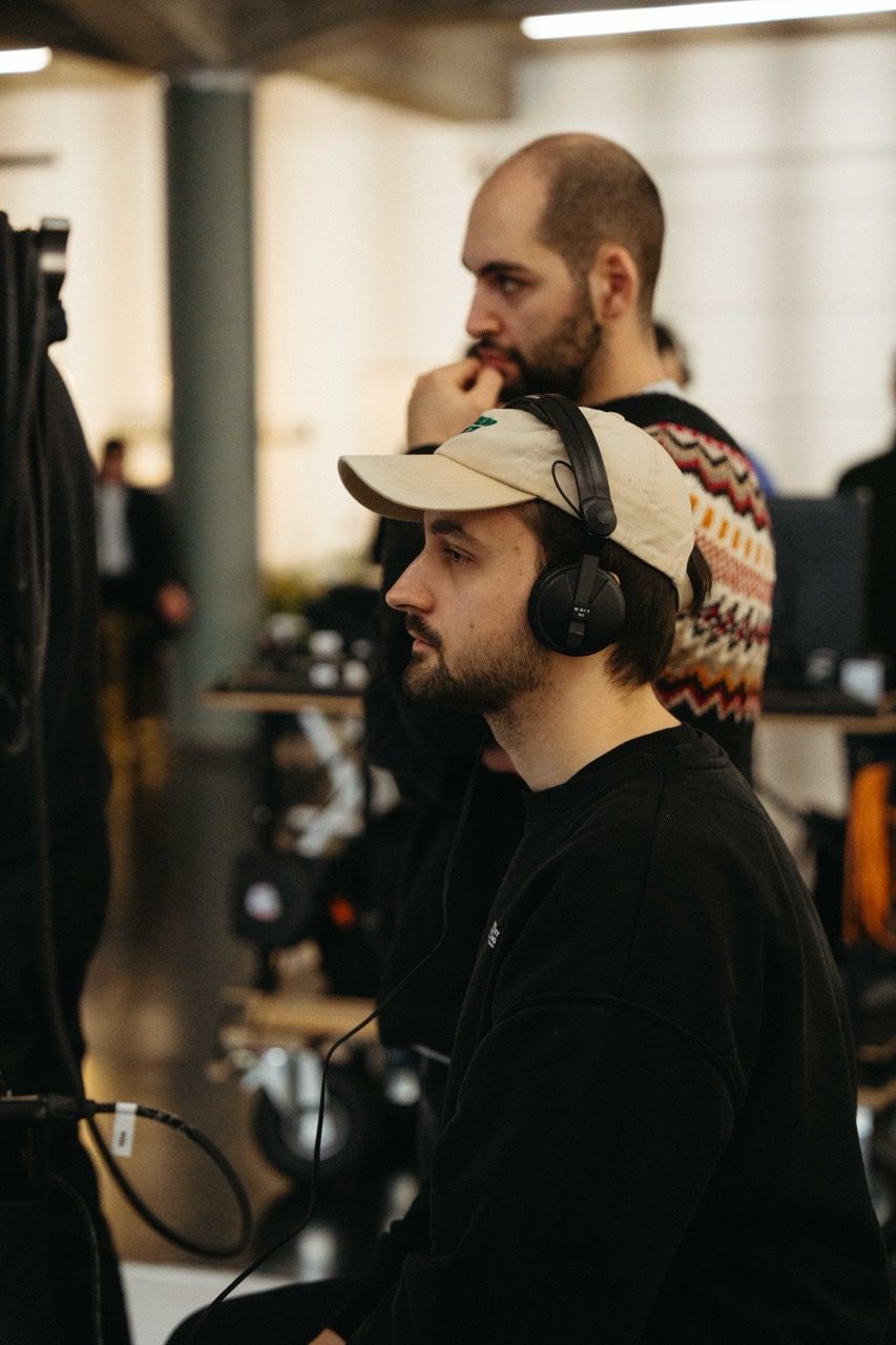 A Visionary Berlin director intently monitoring the performance and audio during the filming of the FDP's 'Alles lässt sich ändern' TV commercial.