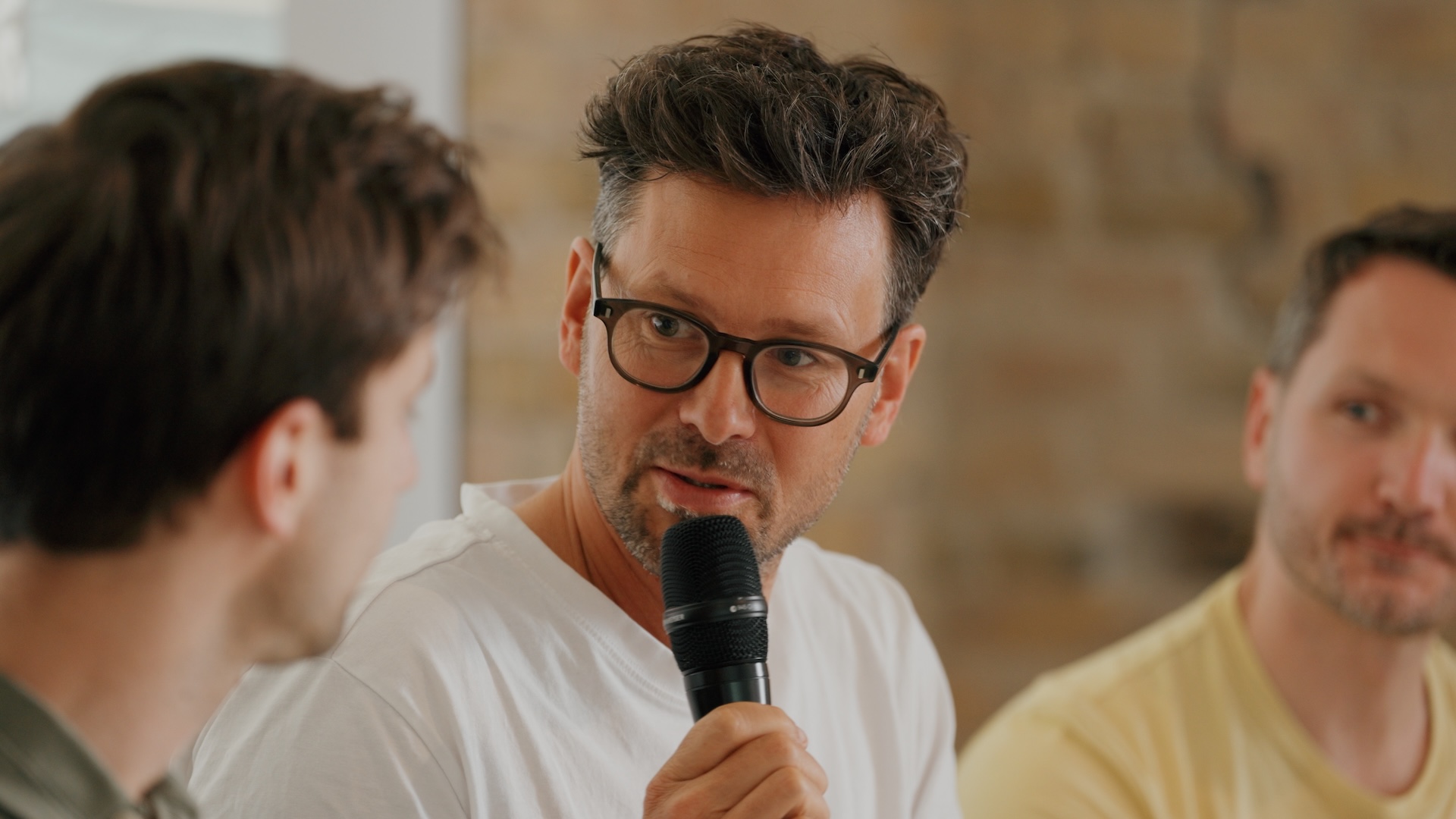 A close-up of a panelist in deep discussion, captured for the w3.hub brand film by Visionary Berlin during an event for Berlin's Web3 community.
